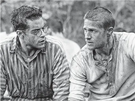  ?? Bleecker Street Media ?? Rami Malek, left, and Charlie Hunnam hatch an escape plan in “Papillon.”