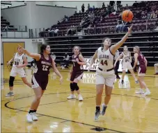  ?? Graham Thomas/Siloam Sunday ?? Siloam Springs senior Mia Hevener stretches out to grab a pass in the first half Friday against Huntsville. Hevener scored all 11 of her points in the first half as Siloam Springs defeated Huntsville 58-35.