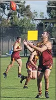  ?? ?? Safety in numbers: Josh Dickerson is surrounded by teammates early in the clash with Nagambie. Stanhope started slowly, but ran out a 19-point winner. In support of Dickerson are Nathan O’reilly, Matt Gill and Jack Young.