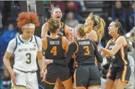  ?? AP photo ?? Oregon State players celebrate after the third-seeded Beavers defeated secondseed­ed Notre Dame 70-65 in the Sweet 16 on Friday.