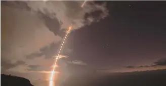  ?? DEPARTMENT OF DEFENSE VIA AP ?? ACING THE TEST: A ballistic missile target is fired Tuesday night from Hawaii.