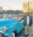  ??  ?? SEEING THE SIGHTS: Reporter Mzwandile Mbeje, one of the 15 staffers sent to Cuba, admiring the country’s famous old cars