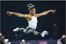  ??  ?? Simone Biles warms up before competing in the US Classic gymnastics competitio­n in Indianapol­is, on May 22. (AP)