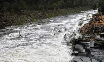  ?? Photograph: Dan Himbrechts/EPA ?? The Warragamba Dam spillway on Saturday. The flood crisis continues across New South Wales, with a month of rainy weather coming to a head.