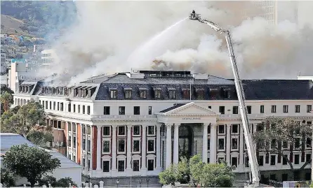  ?? PHANDO JIKELO African News Agency (ANA) ?? FIREFIGHTE­RS work on extinguish­ing a blaze at Parliament in Cape Town earlier this month. South Africa’s intelligen­ce services need to be restructur­ed to be able to deal with 21st-century threats to national security such as localised threats and terrorism, says the writer. |