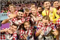 ?? ?? BRONZE BOYS: Croatia’s players celebrate third place