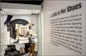  ?? Arkansas Democrat-Gazette/JOHN SYKES JR. ?? A temporary traveling exhibit on women’s footwear, “A Walk in Her Shoes,” includes one example from each decade of the 20th century as well as glass display cases filled with several pairs from each decade.