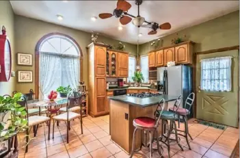  ?? Frank Gutowski photos ?? The kitchen has a 10-foot ceiling and a cooking island.