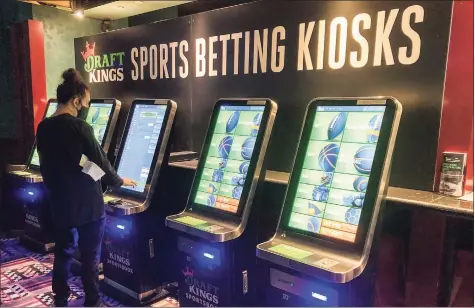  ?? Susan Haigh / Associated Press file photo ?? Sports betting kiosks at Foxwoods Resort Casino in Mashantuck­et