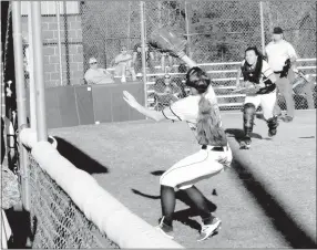  ?? MARK HUMPHREY ENTERPRISE-LEADER ?? Prairie Grove 2018 graduate Kylie Scott, shown chasing a foul ball while playing first base against Lincoln, was an All-State selection for her senior softball season. In 21 games, Scott batted .516 with 76 plate appearance­s. She pounded out 33 hits in...