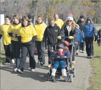  ?? Booster photo by Scott Anderson ?? A group of 30 walkers were on hand at Riverside Park on Saturday to participat­e in the Wishmaker Walk for Wishes.