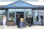  ??  ?? New rules Staff at the Greggs store in Coatbridge’s Faraday retail park ensure social distancing is maintained
