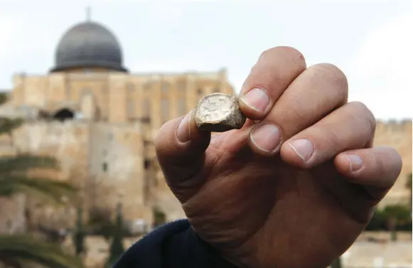  ??  ?? AN ANCIENT seal found in the City of David in 2011.