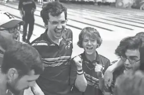  ?? ?? Hilliard Davidson bowlers (l-r) Caelen Guthrie, Aiden Lieb and Nicholas Bremer celebrate during the OHSAA Division I boys state bowling tournament in Columbus on Saturday.