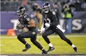  ?? NICK WASS/THE ASSOCIATED PRESS ?? Ravens cornerback Anthony Levine, left, rushes the ball after intercepti­ng a pass attempt during Monday’s game against the Houston Texans in Baltimore. The Ravens won 23-16.