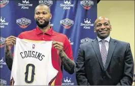  ?? TED JACKSON / AP ?? DeMarcus Cousins, with New Orleans GM Dell Demps, thinks the Pelicans “can wreak havoc on this league” with him and Anthony Davis in the frontcourt.