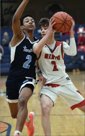  ?? PATRICK HOPKINS — FOR THE NEWS-HERALD ?? Mentor’s Luke Chicone drives against Benedictin­e’s Jashun Cobb on Dec. 29 at Garfield Heights.