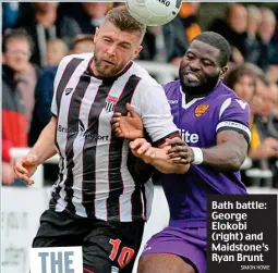  ?? SIMON HOWE ?? Bath battle: George Elokobi (right) and Maidstone’s Ryan Brunt