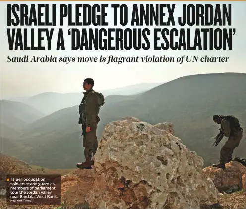  ?? New York Times ?? Israeli occupation soldiers stand guard as members of parliament tour the Jordan Valley near Bardala, West Bank.