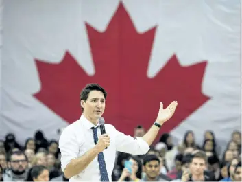  ?? NATHAN DENETTE/THE CANADIAN PRESS ?? Prime Minister Justin Trudeau answers questions from the public during his town hall meeting Wednesday in Hamilton, Ont.