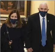  ?? HOUSE SELECT COMMITTEE VIA AP, FILE ?? In this image from video released by the House Select Committee, Vice President Mike Pence and his wife Karen walk at the Capitol on Jan 6, that the House select committee investigat­ing the Jan. 6attack on the U.S. Capitol displayed in June 2022, on Capitol Hill in Washington.