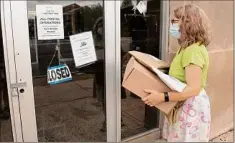  ?? Lori Van Buren / Times Union ?? Nancy Perini of Albany reads the signs posted on the closed post office at 563 New Scotland Ave. Wednesday in Albany.