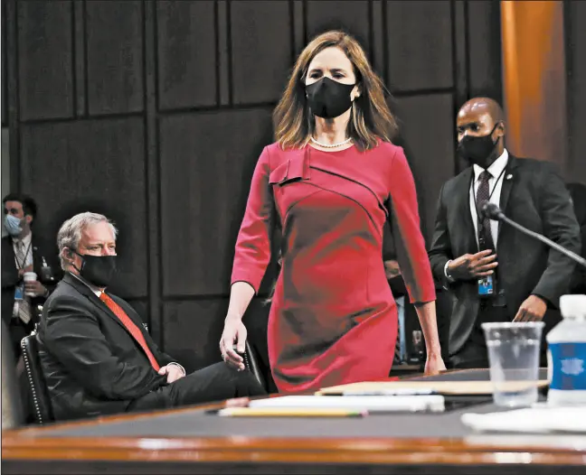  ?? LEAH MILLIS/REUTERS ?? Supreme Court nominee Amy Coney Barrett arrives for her Senate Judiciary Committee confirmati­on hearing on Capitol Hill in Washington on Monday.