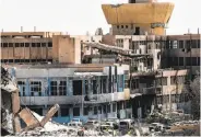  ?? Bulent Kilic / AFP / Getty Images ?? Damaged hospitals like this one in Raqqa have cut off health care to hundreds of thousands of people.