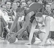  ?? Ben Margot / Associated Press ?? The Rockets’ Trevor Ariza, left, and the Warriors’ Klay Thompson dive for a loose ball Friday. For more game details, go to chron.com/rockets.