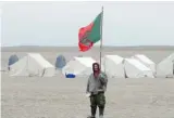  ?? Sean Kilpatrick/the Canadian Press ?? A Canadian Ranger flies the Ranger’s flag at a camp near Gjoa Haven, Nunavut on Wednesday.