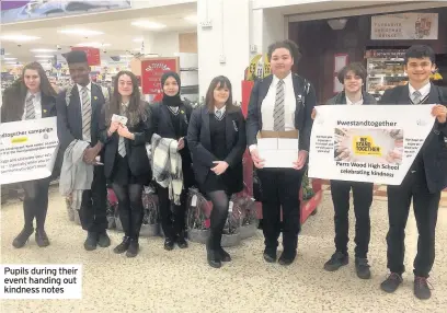  ??  ?? Pupils during their event handing out kindness notes