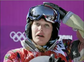  ??  ?? Lindsey Jacobellis of the United States reacts after winning the small final of the women’s snowboard cross at the Rosa Khutor Extreme Park, at the 2014 Winter Olympics on Feb. 16 in Krasnaya Polyana, Russia.