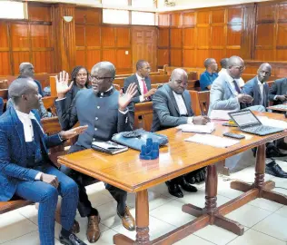  ?? AP PHOTOS ?? Lawyers react as Justice Chacha Mwita delivers judgment on a petition against the deployment of Kenyan forces to Haiti, at Milimani court in the capital Nairobi, Kenya, Friday, January 26, 2024. A Kenyan court on Friday blocked the deployment of 1,000 police officers to Haiti to help the Caribbean nation deal with gang violence.