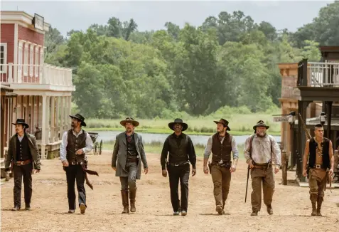  ??  ?? LEAD SEVEN: Byung-hun Lee, left, Manuel Garcia-Rulfo, Ethan Hawke, Denzel Washington, Chris Pratt, Vincent D’Onofrio and Martin Sensmeier in a scene from The Magnificen­t Seven.