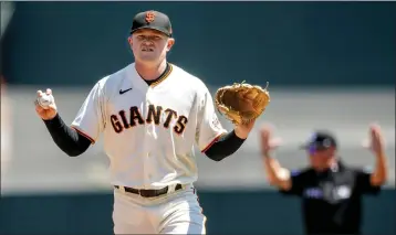  ?? KARL MONDON — BAY AREA NEWS GROUP FILE ?? Giants starting pitcher Logan Webb asks for a new ball while struggling against the Arizona Diamondbac­ks on Aug. 18.