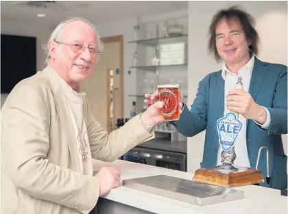  ??  ?? Prof Julian Lloyd Webber pulls Christophe­r Morley a pint at the opening of the new Royal Birmingham Conservato­ire