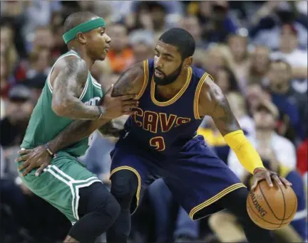  ?? RON SCHWANE — ASSOCIATED PRESS ?? Kyrie Irving looks to drive against the Celtics’ Isaiah Thomas in a game last season. The star guards headlined a blockbuste­r trade Aug. 22.