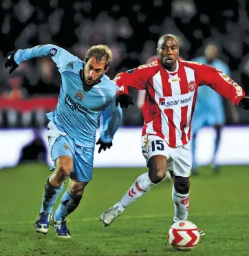  ??  ?? (Above) Nomvethe battles Manchester City’s Pablo Zabaleta in a UEFA Cup clash while turning out for Danish club Aalborg.