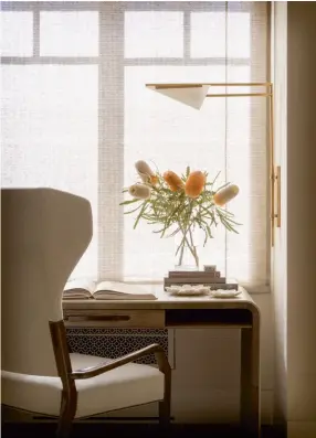  ??  ?? From top: The soft leather on the Blaire writing desk from Joseph Jeup and a Chiffchaff Chair from Gregorius Pineo imbue this space with a sense of cosiness; Laurel chairs in dusty pink by Kelly Wearstler and flamestitc­h velvet-and-linen sofa from Dmitriy & Co add colour and texture to the lounge area Opposite, clockwise from top: The kitchen features an island with a Calacatta marble countertop, flanked by cream and bronze Elliott counter stools by Kelly Wearstler; The dining area features the Bangle table from Hudson Furniture, which has a walnut top with a live edge; In this breakfast nook, a John Liston chandelier floats above a Hélène Aumont table and a custom banquette