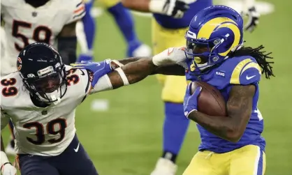  ?? Photograph: Kelvin Kuo/AP ?? Los Angeles Rams running back Darrell Henderson, right, tries to get around Chicago Bears defensive back Eddie Jackson during the second half of Thursday’s game.