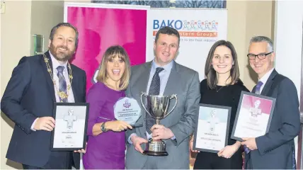  ??  ?? Worthy winners Hugh and Laura alongside Scottish Bakers president Ronnie Miles, far left, Carol Smillie and Scottish Bakers CEO Alasdair Smith, far right