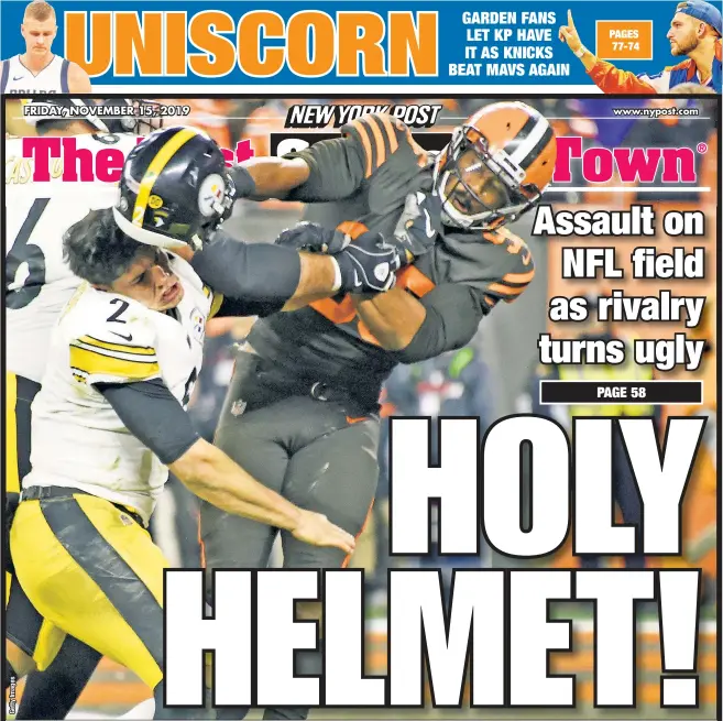  ??  ?? Myles Garrett — the top pick in the 2017 draft and the Browns’ best defensive player — slams Steelers rookie QB Mason Rudolph over the head with his own helmet in the closing seconds of Cleveland’s 21-7 win. Players from both teams came off the sidelines in one of the wildest fights in NFL history.