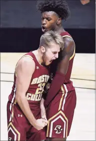  ?? Jessica Hill / Associated Press ?? Boston College's Rich Kelly, left, and CJ Felder celebrate during the second half against Rhode Island last week in Uncasville.