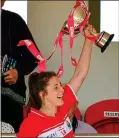  ??  ?? REBEL YELL: Ciara O’Sullivan of Cork lifting the cup yesterday