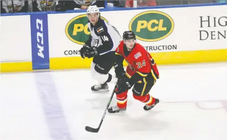  ?? STOCKTON HEAT ?? Flames prospect Martin Pospisil, front, made the leap from USHL junior A to the American Hockey League in the 2019-20 season.