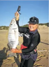  ??  ?? REELING THEM IN: Port Alfred Rock and Surf member Jo-Anne Hilliar won the catch of the day prize in the latest round robin for her heaviest fish caught and released, a 5.9kg steenie
