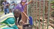  ?? Picture: Jason Boud/Africa News Agency/ANA ?? ENFORCER: Mayor Patricia de Lille inspects a water restrictor at a house in Pinelands.