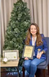  ?? PHOTOGRAPH­S COURTESY OF LIVINGSPRI­NGS ?? LIVINGSPRI­NGS managing director Monique Albert-Lopez with the award trophy and plaque for Best Luxury Real Estate Developer in the Philippine­s from Luxury Lifestyle Award 2021.