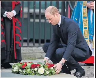  ??  ?? TRIBUTE: Duke of Cambridge lays flowers at Westminste­r Abbey memorial