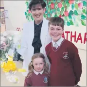  ?? (Photo: Dave Lucey) ?? RIGHT: Scoil an Athar Tadhg pupils Eamonn Tattan and Pippa Cashman with Minister Norma Foley during her visit.